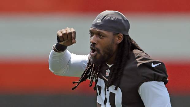 Cleveland Browns defensive end Jadeveon Clowney chants along with fans during NFL football training camp, Friday, July 30, 2021, in Berea, Ohio. Brownscamp31 12